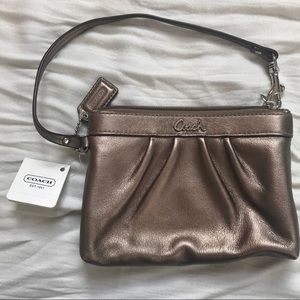 NWT Coach bronze wristlet clutch